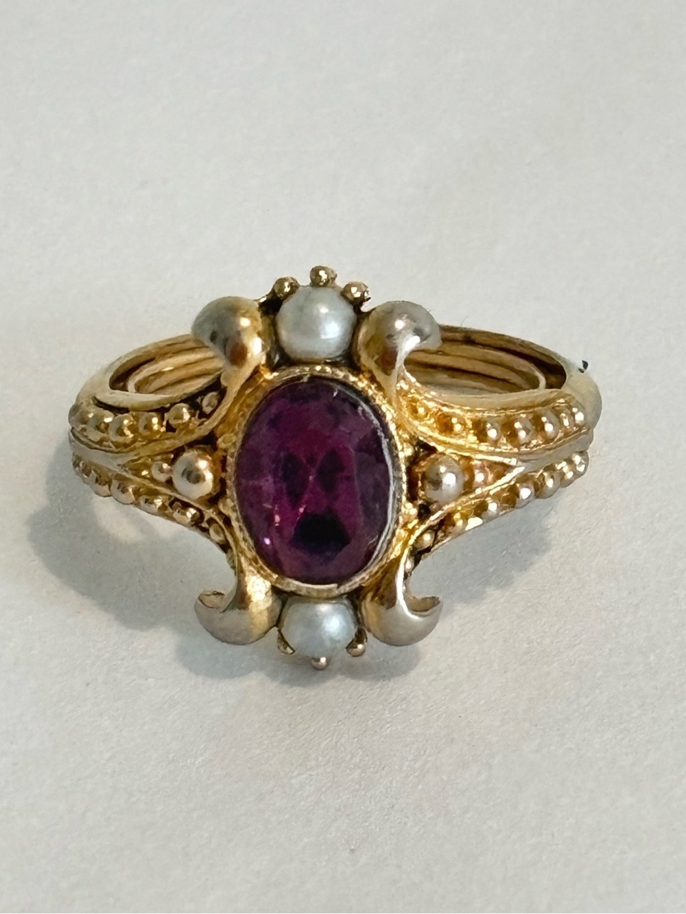 Vintage Avon Gold-Tone Ring with Purple Stone and faux Pearl Accents 5 3/4-6 1/2